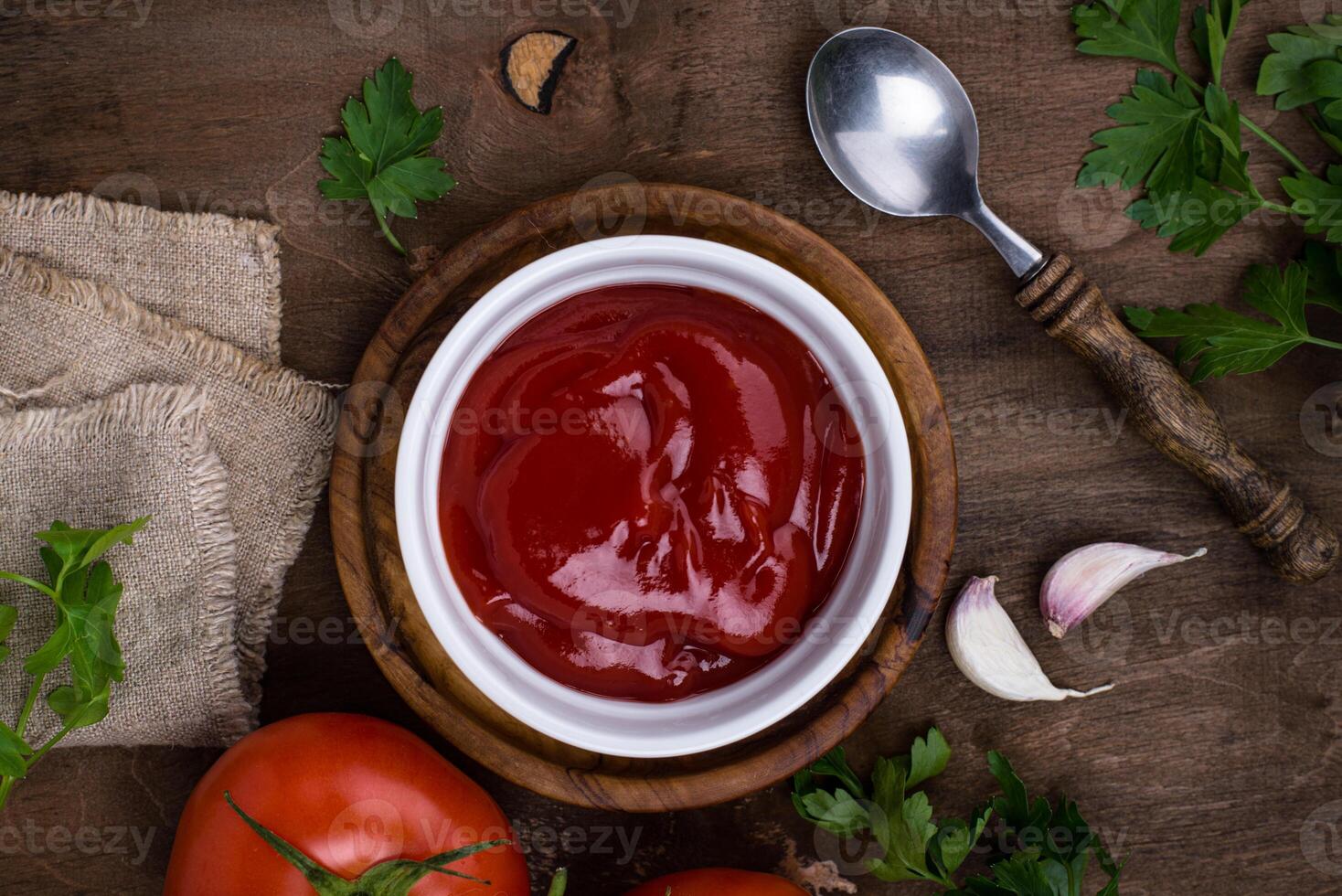 Fresh homemade tomato sauce with garlic photo