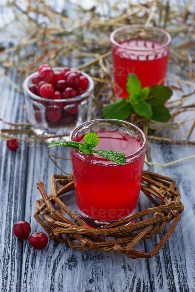 Glasses of fresh cranberry drink photo
