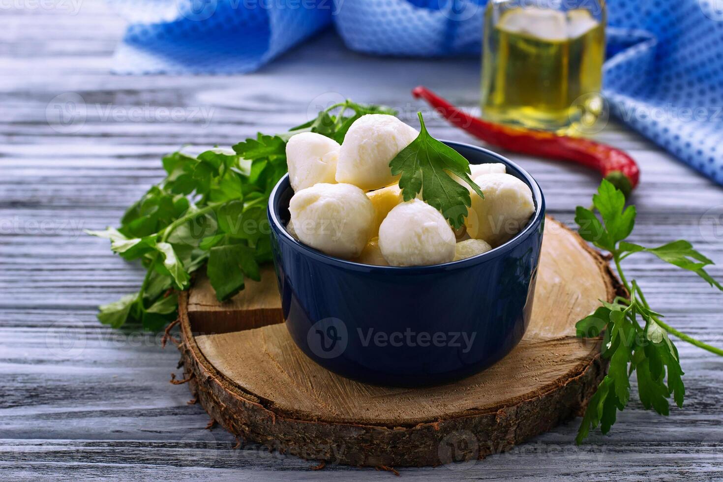 Italian cheese mozzarella in blue bowl photo