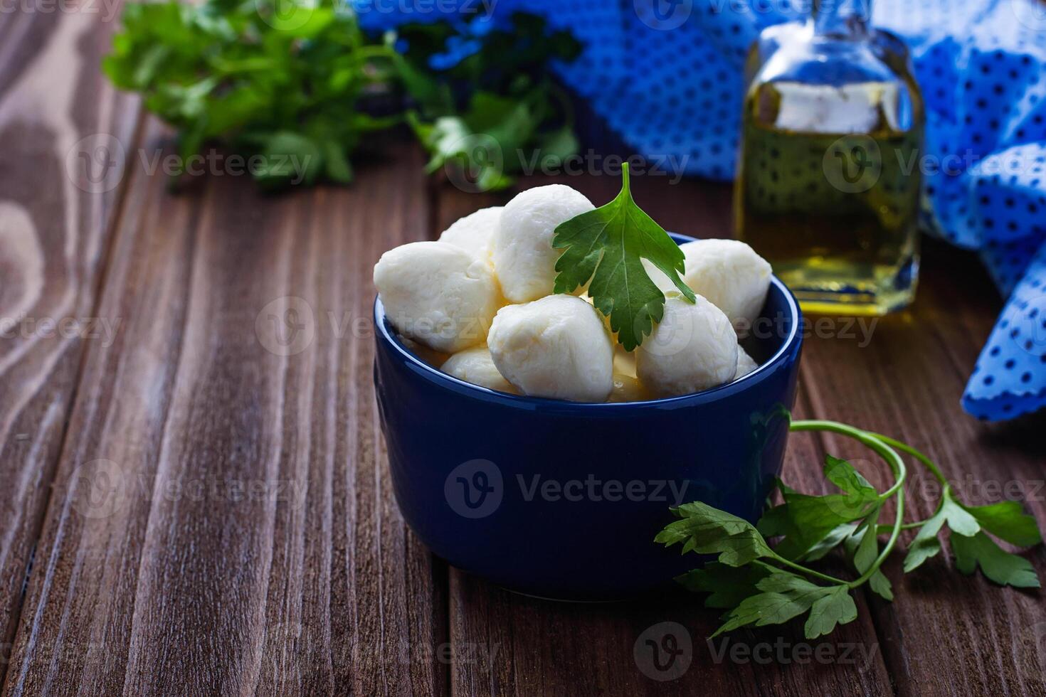 Italian cheese mozzarella in blue bowl photo