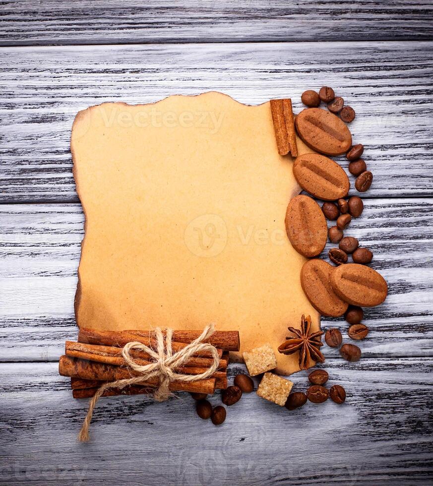 Coffee, sugar, cinnamon, cookies and vintage paper photo