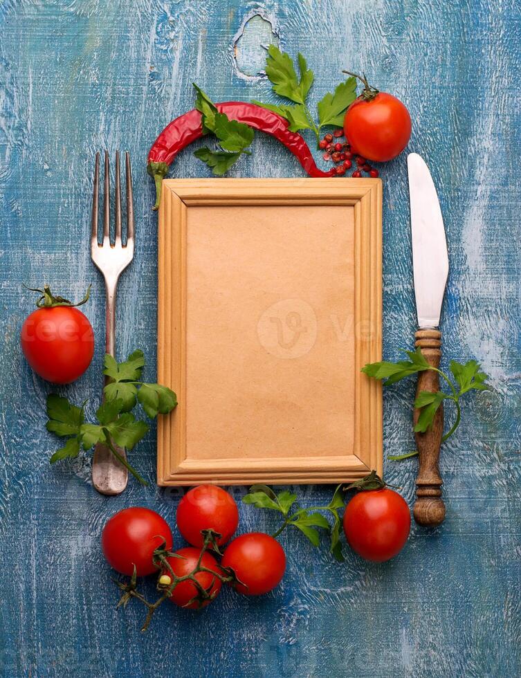 Fresh cherry tomato, parsley and frame for text photo