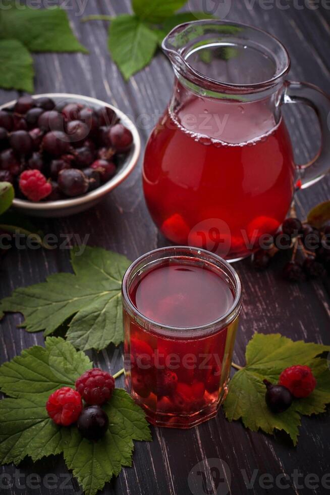 Fresh berry drink with black currant and raspberries photo