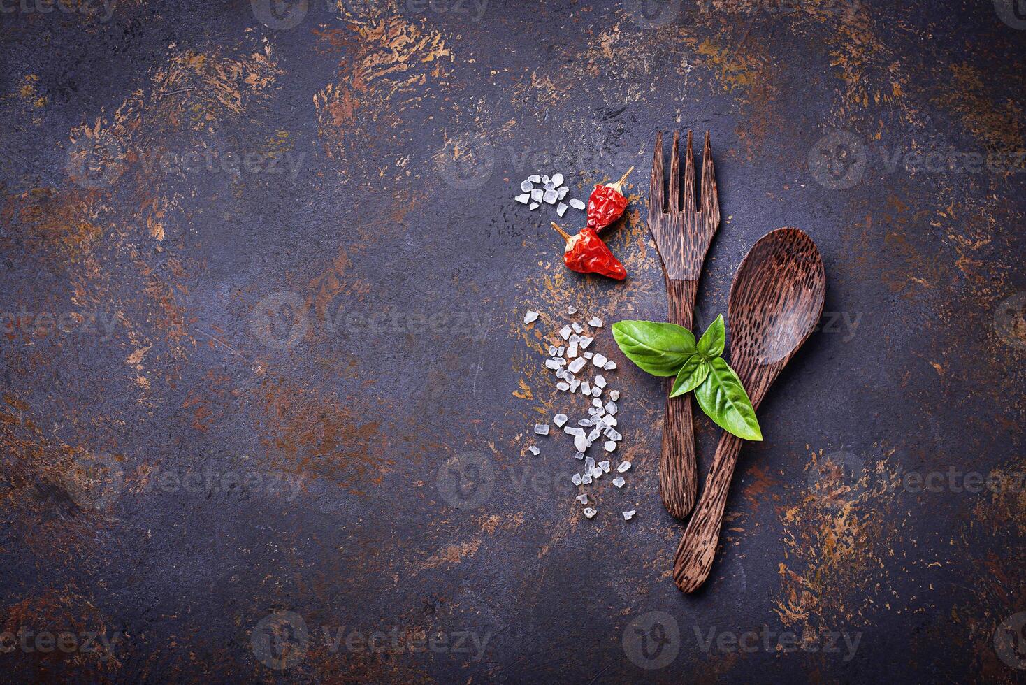 Fork and spoon with herbs and spices. photo
