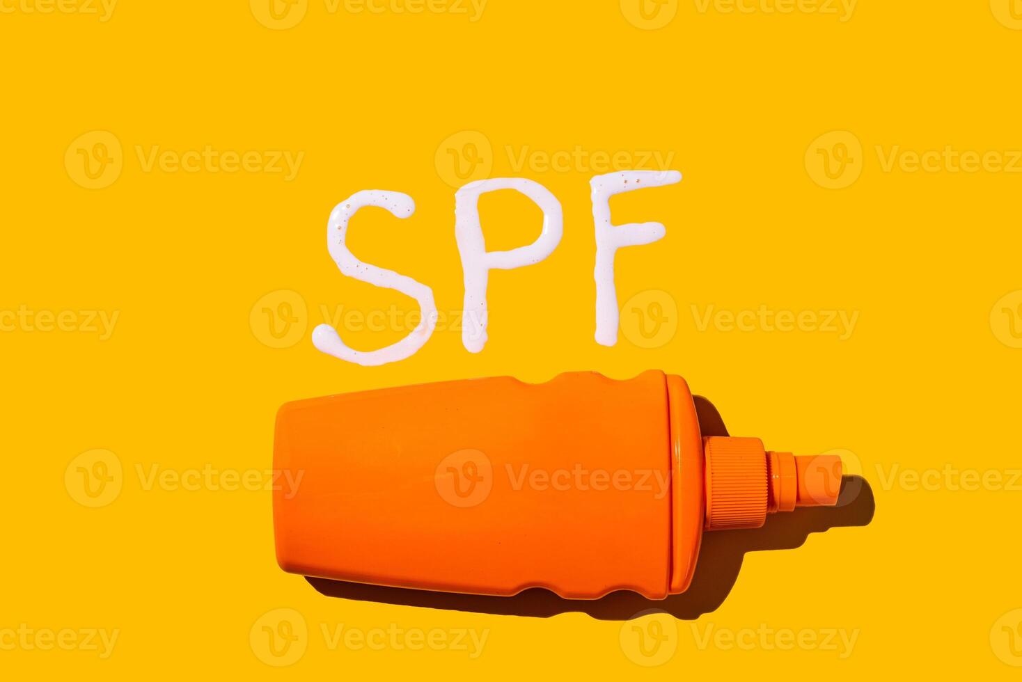 Sunscreen SPF cream on yellow background photo