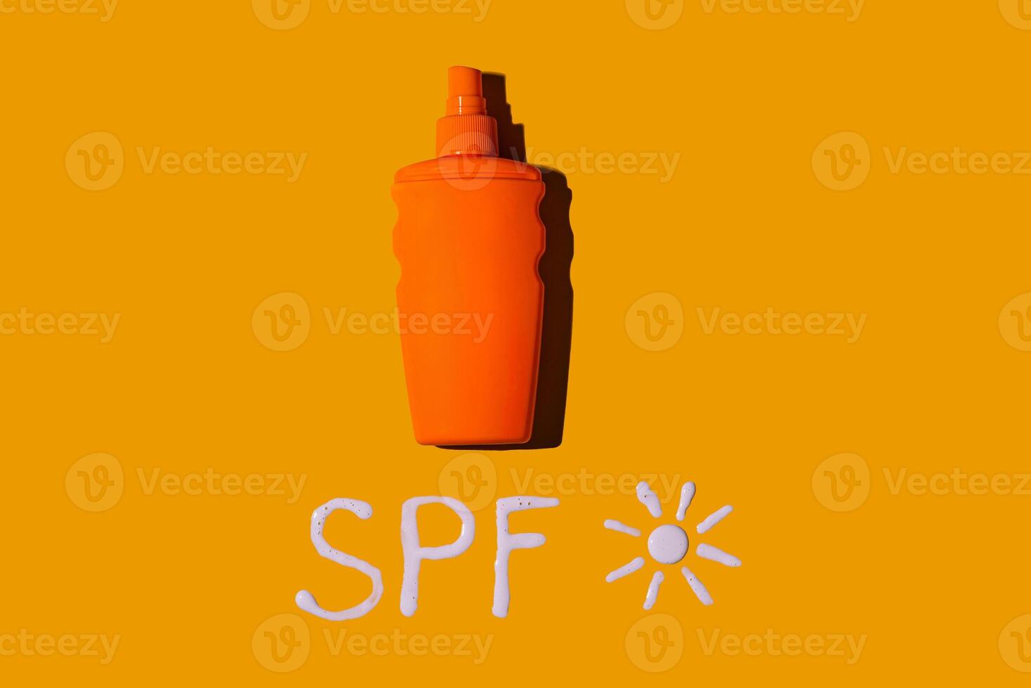 Sunscreen SPF cream on yellow background photo