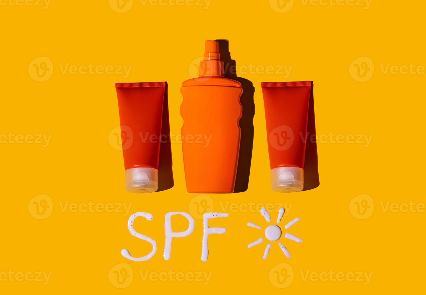 Sunscreen SPF cream on yellow background photo