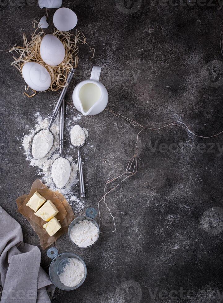 Wheat flour on dark. Baking background photo
