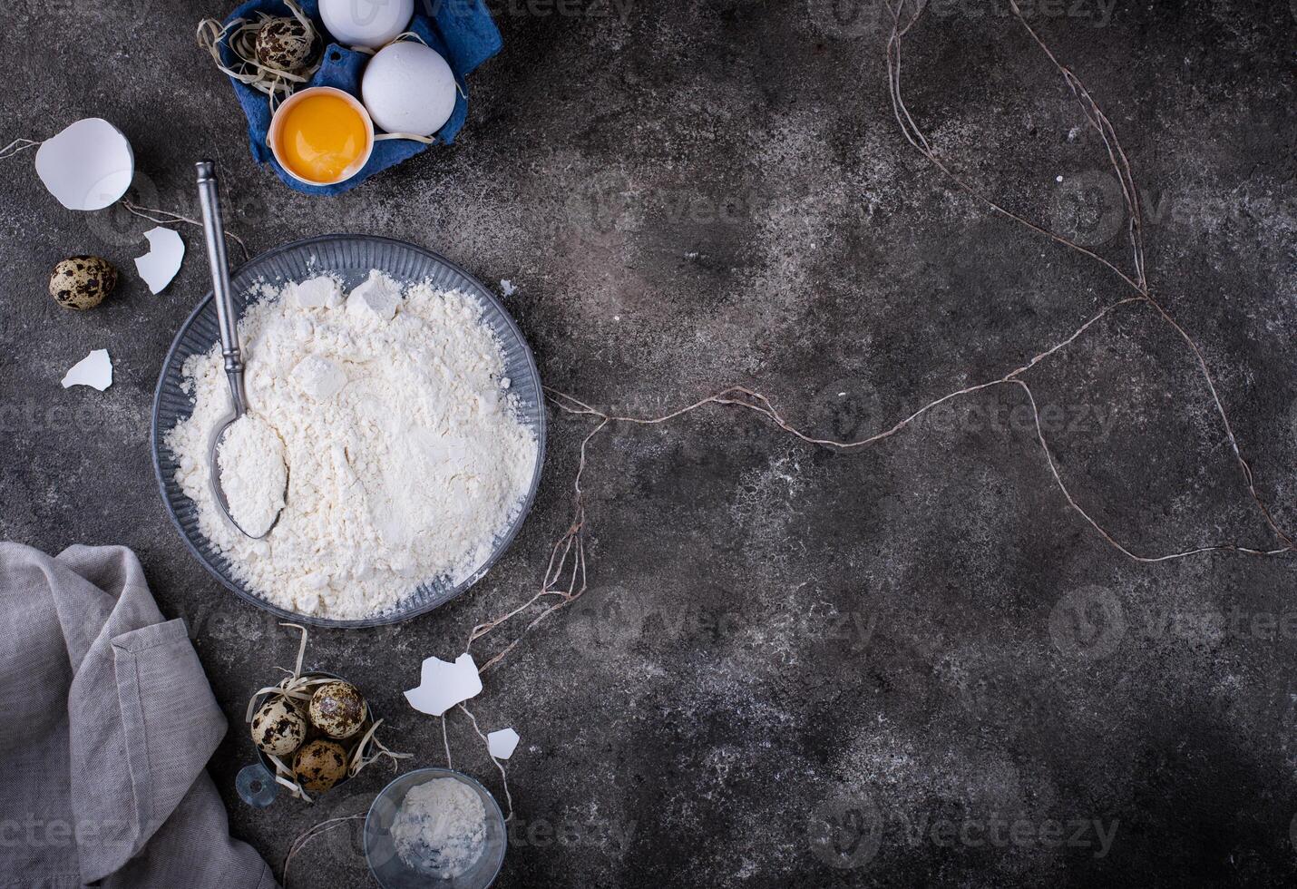 Baking ingredients with flour and eggs photo
