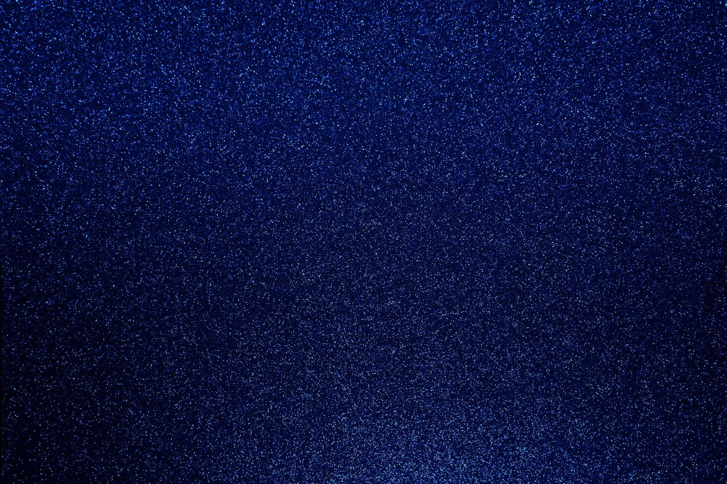 Dark blue bokeh glitter texture christmas abstract background photo