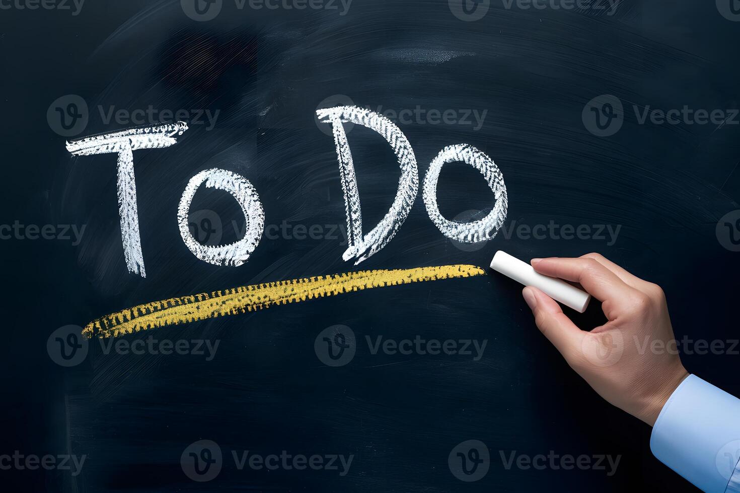 Chalkboard with TO DO and hand holding chalk, classroom feel photo