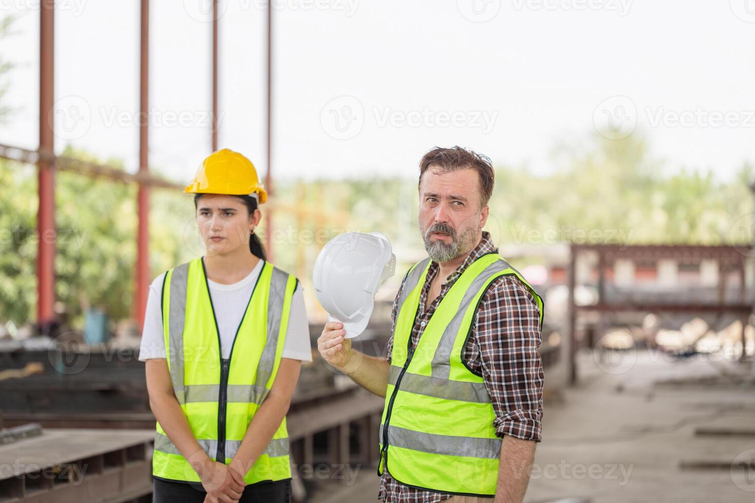Tired fatigued engineer worker constructor working in construction site, Foreman team checking project at the precast concrete factory site photo