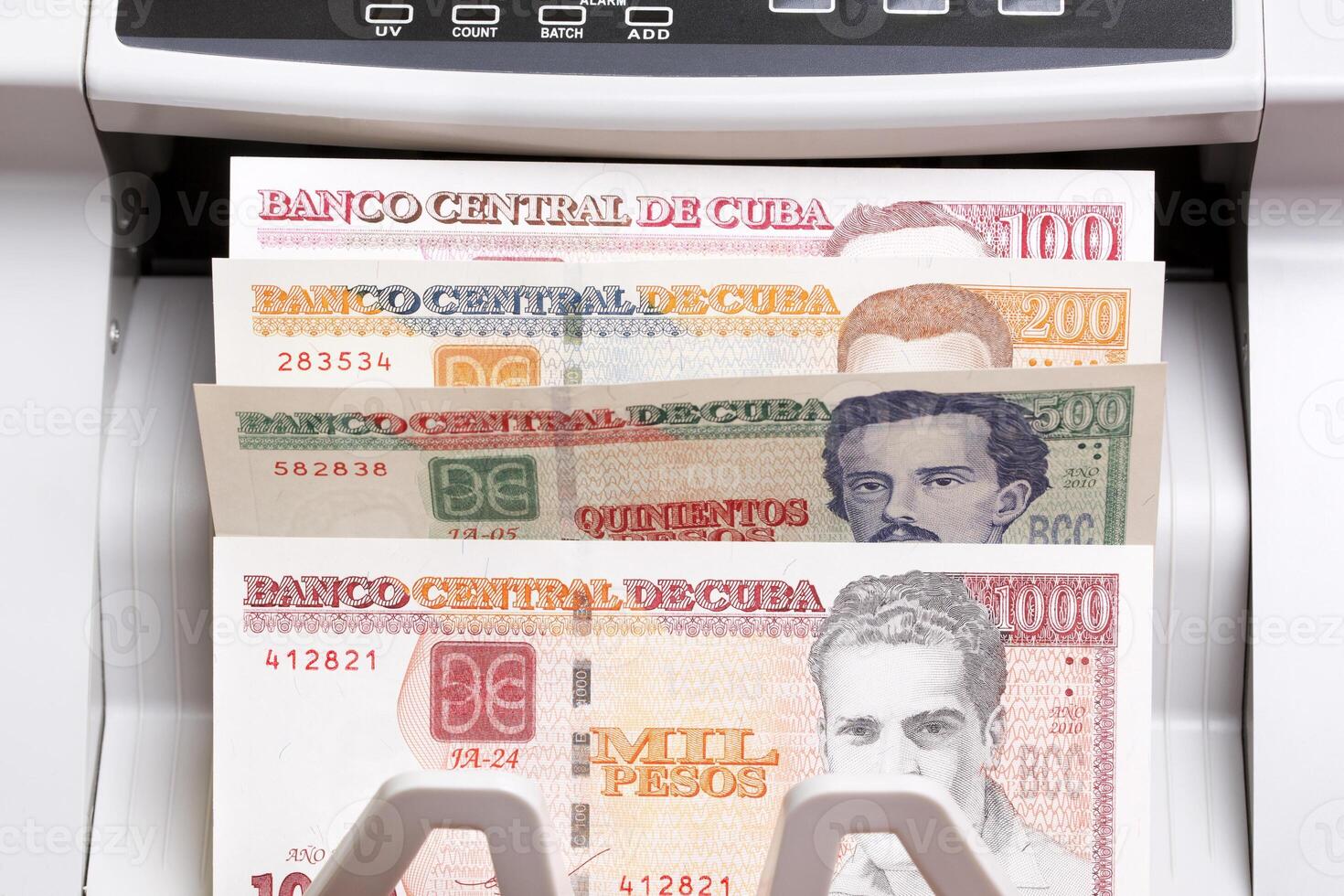 Cuban Peso in the counting machine photo