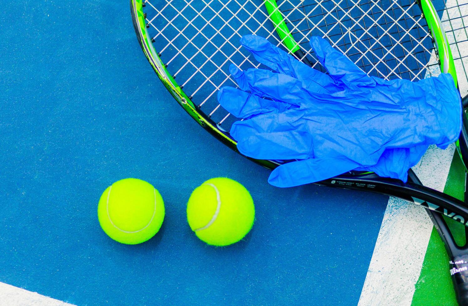 Tennis Safety Equipment with Gloves on Racket. Minsk, Belarus - October 18, 2021 photo