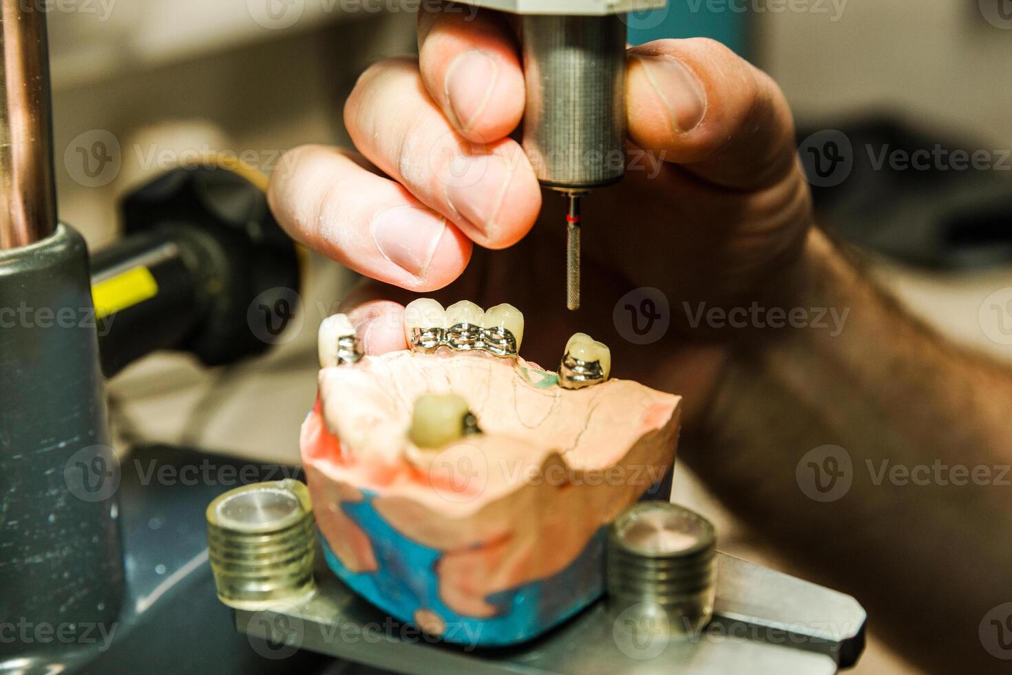 Detailed view of dental drilling process on a mold photo