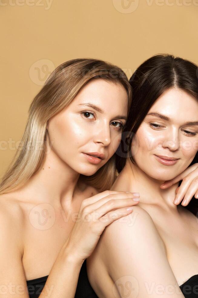 Two Women with Flawless Skin in Studio photo
