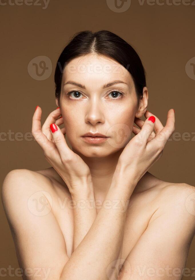 Middle-Aged Woman with Natural Beauty Highlighting Self-Care photo
