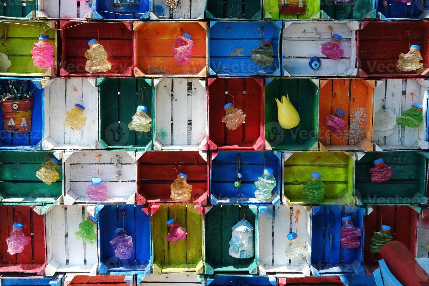 Colorful Wooden Boxes with Recycled Bottles photo