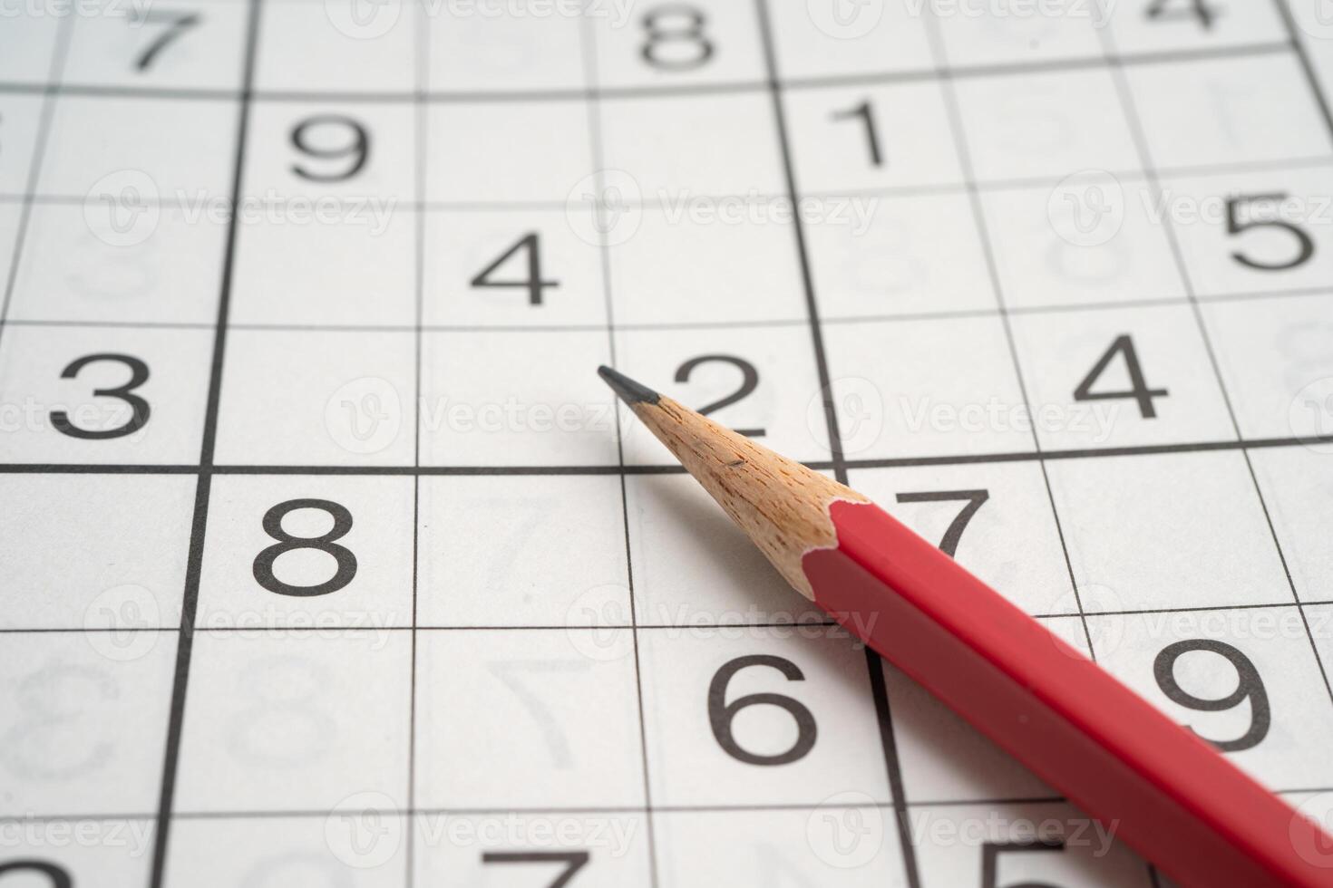 Sudoku puzzle game playing to challenge brain. photo
