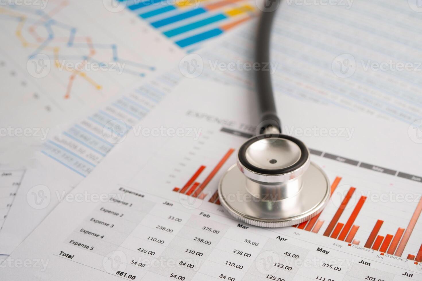 Stethoscope on spreadsheet and graph paper, Finance, Account, Statistics, Investment, Analytic research data economy and Business company concept. photo