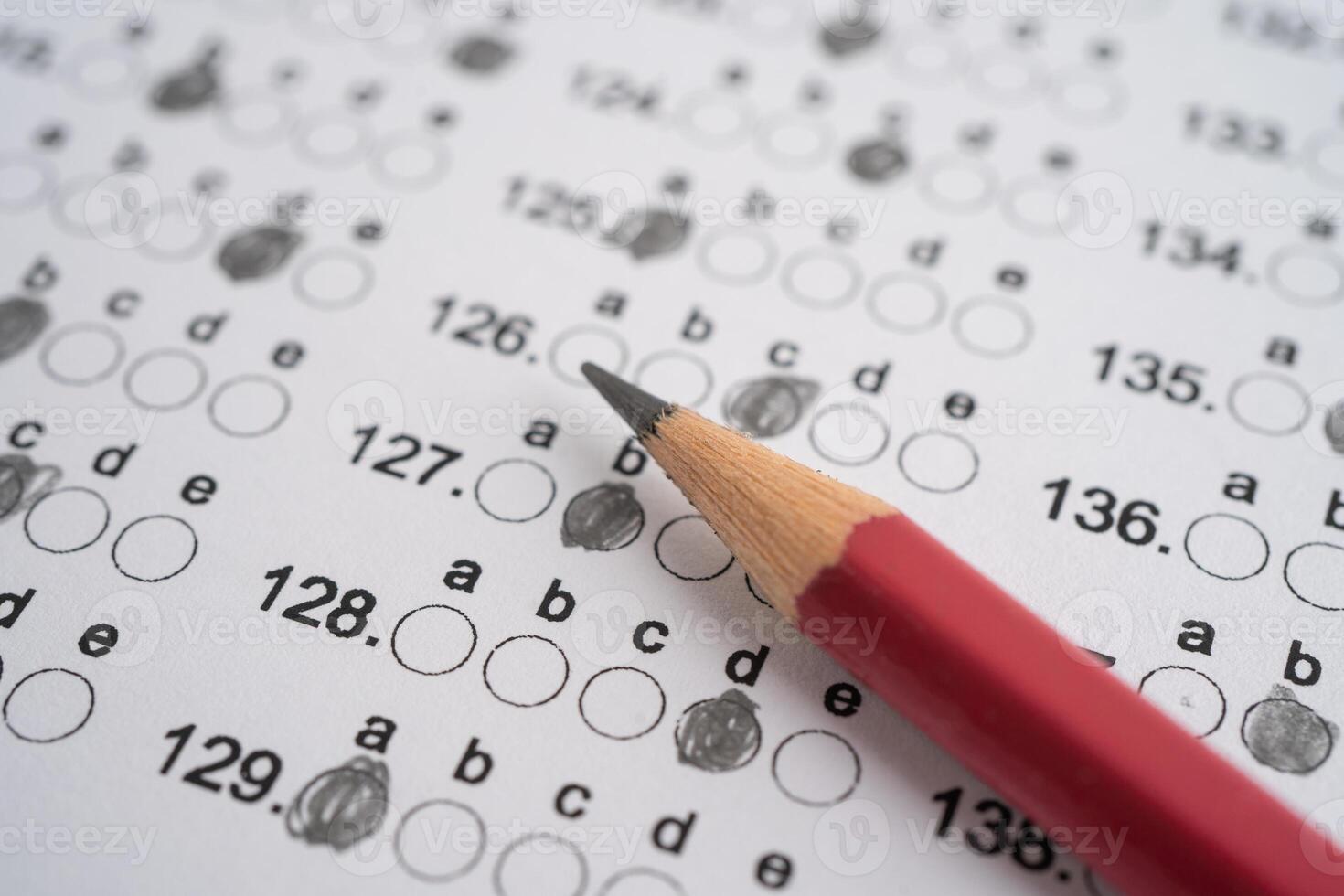 Answer sheets with pencil drawing fill to select choice, education concept. photo