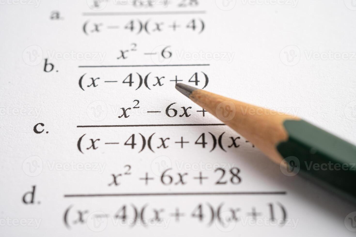 Pencil on mathematic formula exercise test paper in education school. photo