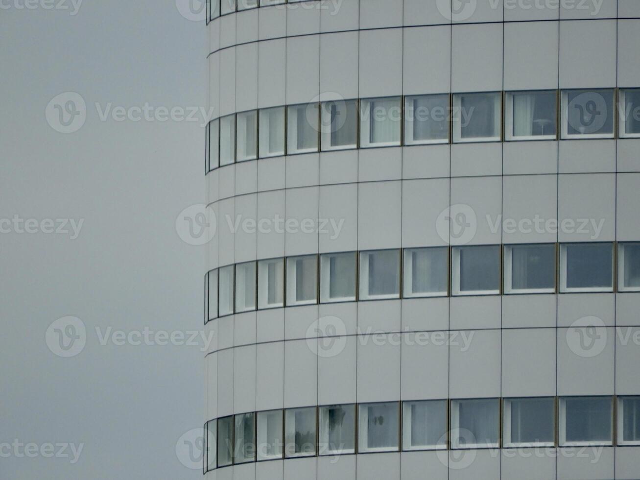 at the top of a round skyskraper photo