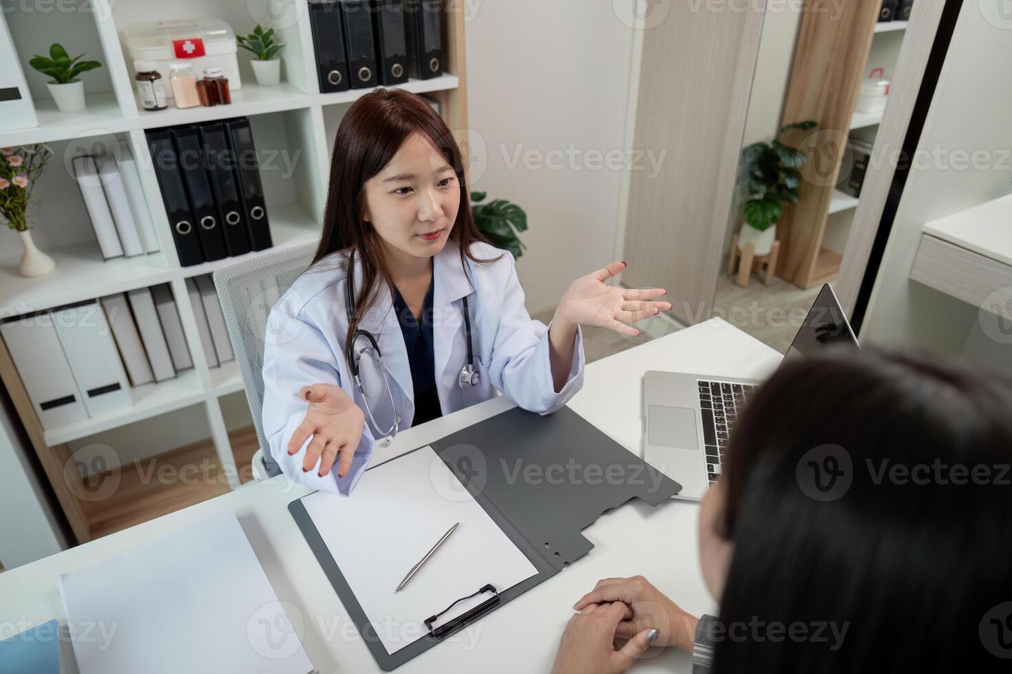 Doctor Consulting with Patient in Modern Medical Office, Discussing Health Concerns and Treatment Plans photo