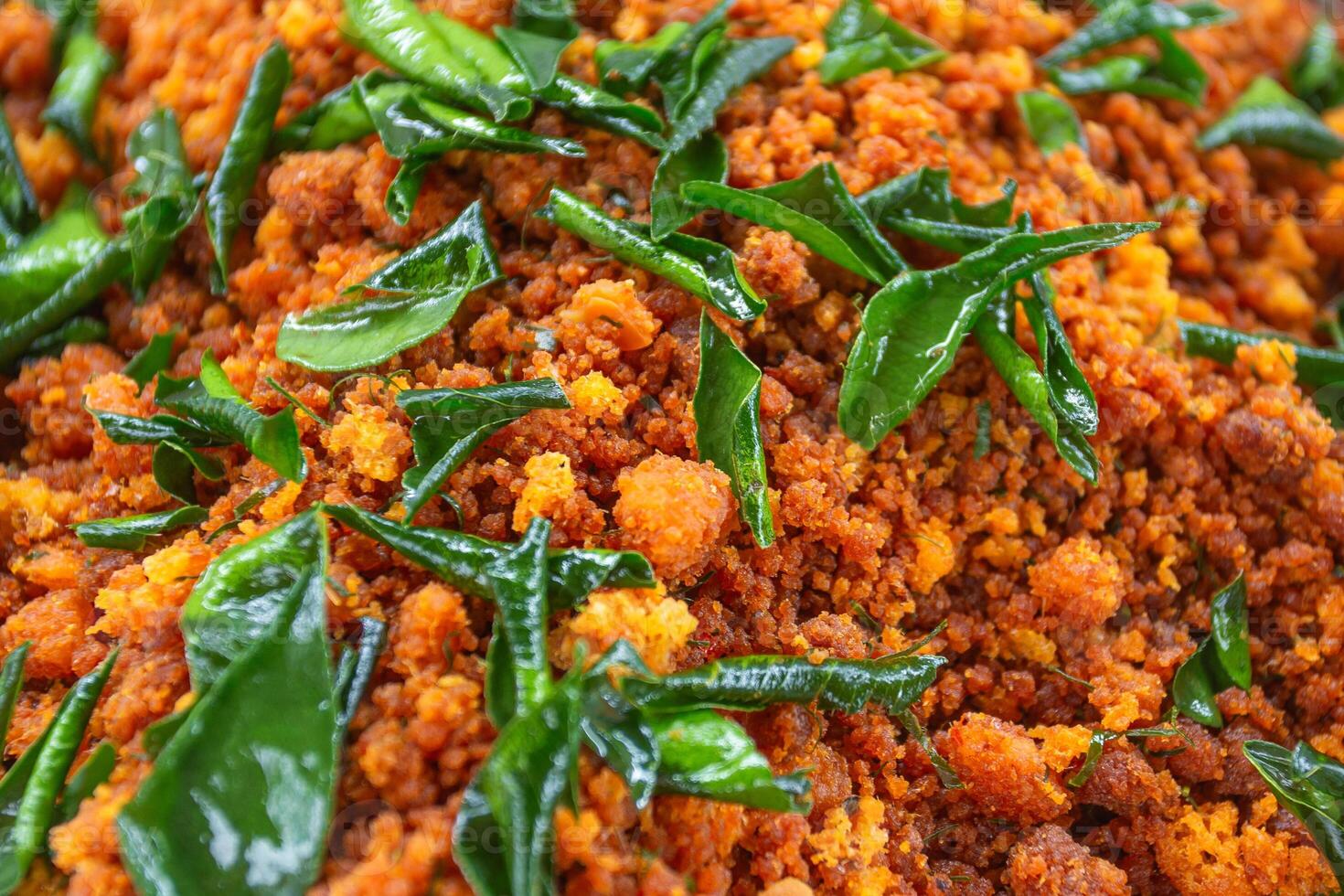 Catfish stir-fried with ginger is a spicy and delicious Thai food with many ingredients such as red curry paste and kaffir lime leaves. photo