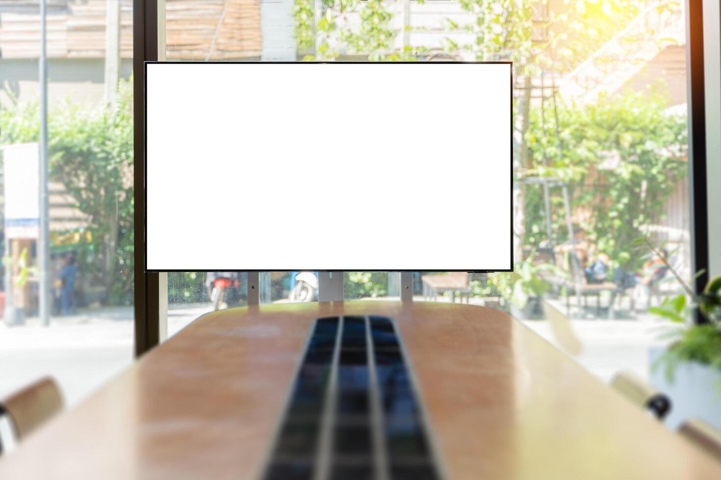 Conference room with blank, empty TV screen. Monitor mock up. Business meeting room with LCD screen for presentation, advertising. Modern, contemporary office. Free, copy space. photo
