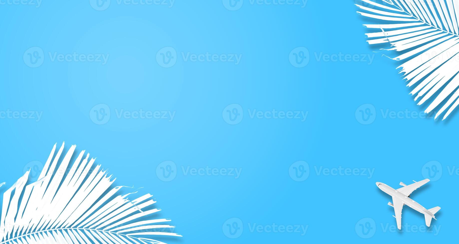 Coconut palm tree with airplane model plane on blue pastel background. Travel flat lay composition airplane on blue background with copy space photo