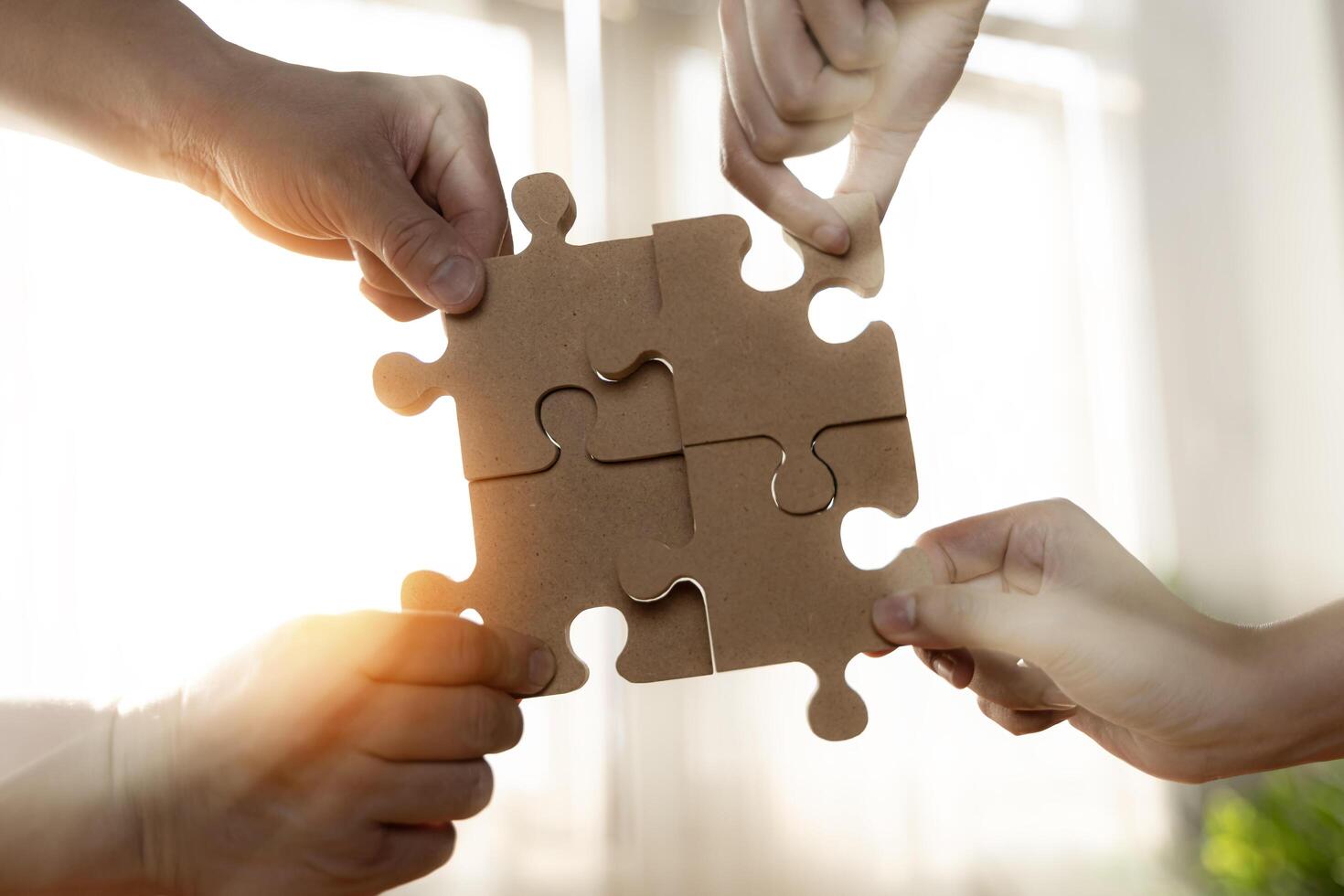 Businessmen working together to build a puzzle. Concept of teamwork, partnership, integration and startup. businessman and businesswoman photo