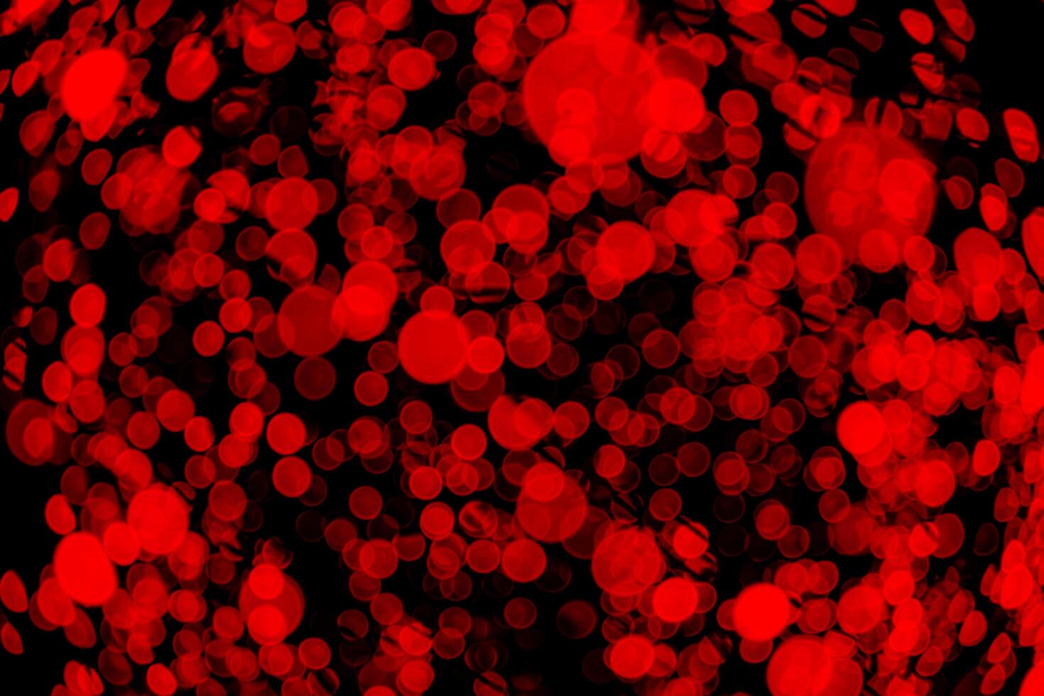 Red circles on a dark background close-up. abstract background photo