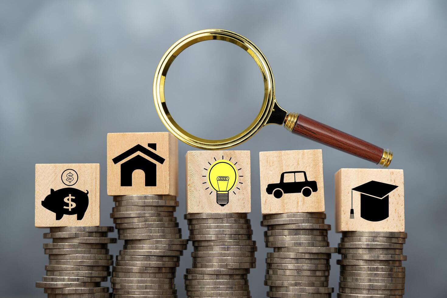 Business strategy, business management or business success concept. Wooden blocks with business icons piggy bank, light bulb, education, house, car. photo