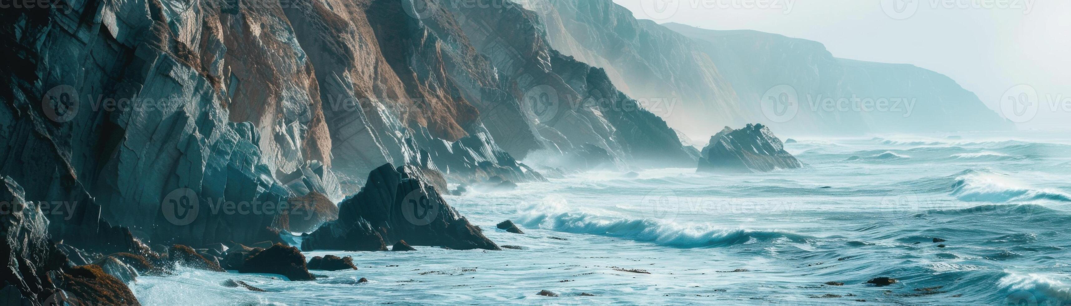 A large wave crashing into a rocky shoreline photo