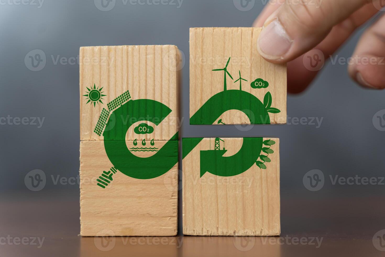 Hand put wooden cube symbol of infinite energy. Circular economy concept, recycle, environment, reuse, manufacturing, waste, consumer, resource. photo