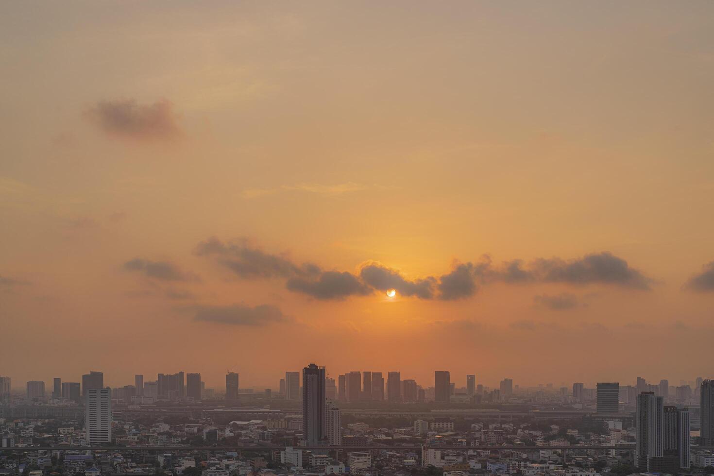 PM 2.5 dust in Bangkok,Capital city are covered by heavy smog,Sunset in downtown with bad air pollution, the Place to risk of cancer photo