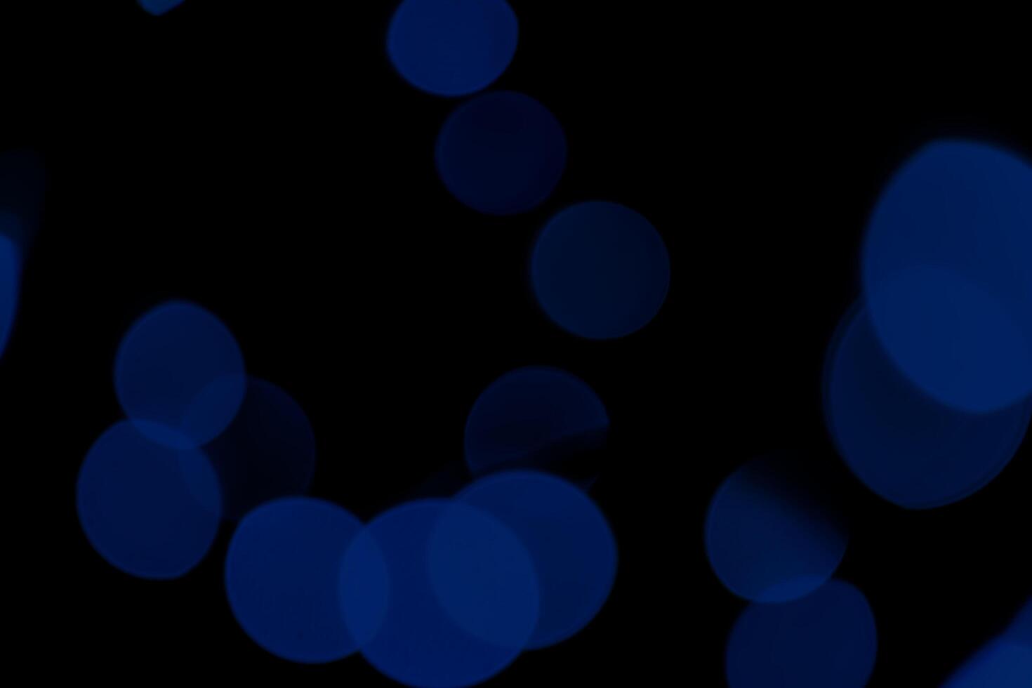 Abstract Blue Particle Glitter Luxury. Abstract bokeh on dark blue background. Holiday concept photo