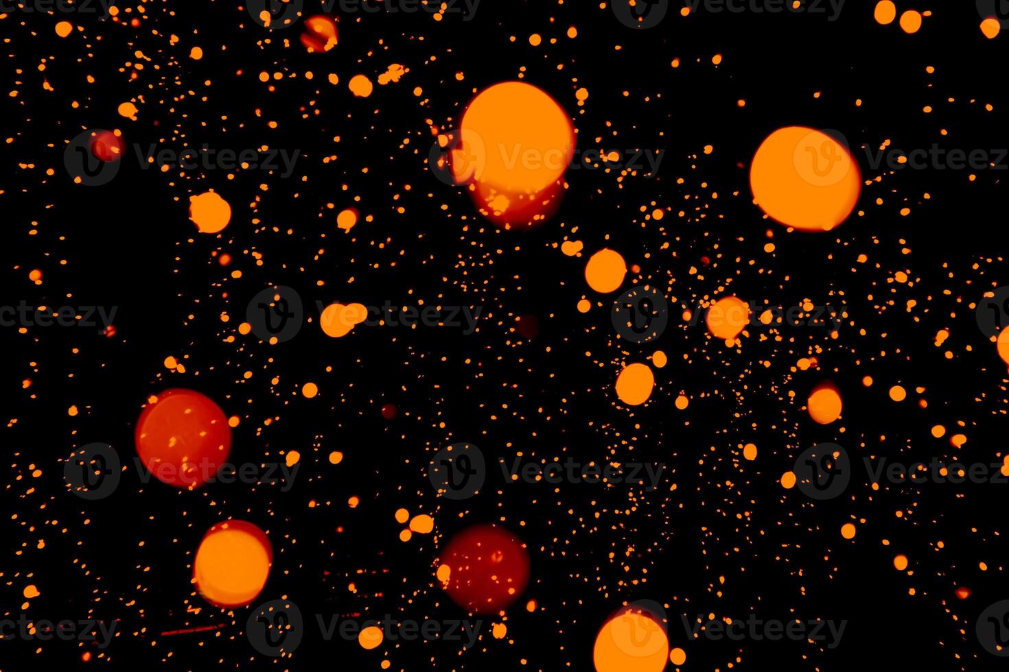 Red, yellow, orange circles on a dark background close-up. abstract background photo