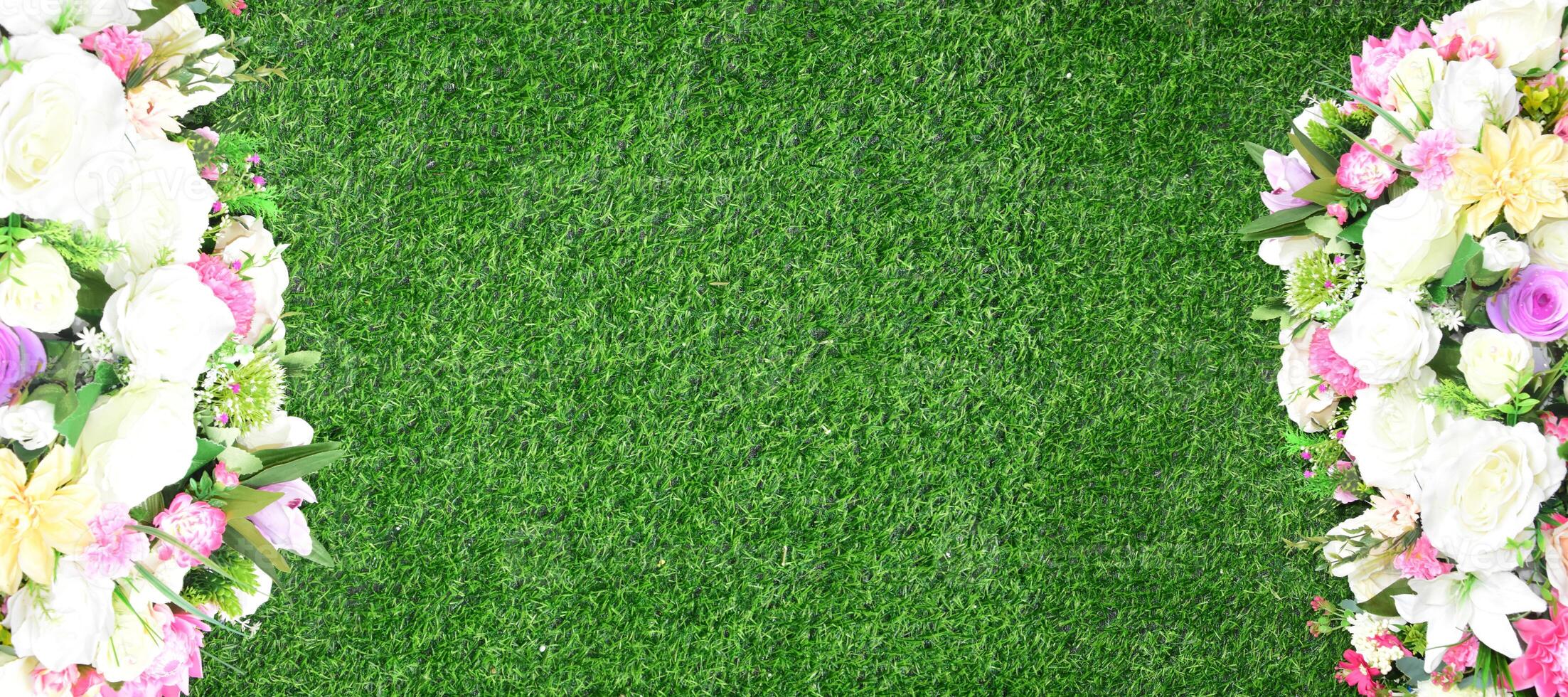 Beautiful wall from various artificial creeper plant for background. Combination of plants, artificial grass. photo
