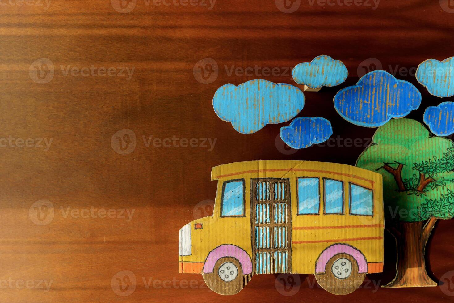 Education and back to school concept, pencils stand as bus on wooden table in classroom. photo