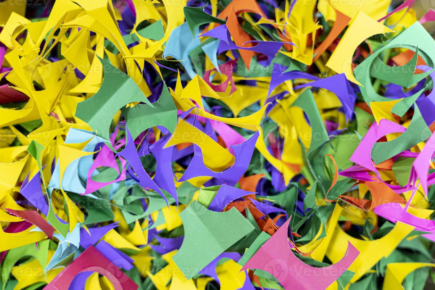 Color shredded confetti paper gift box filler. Abstract bright colored background. photo