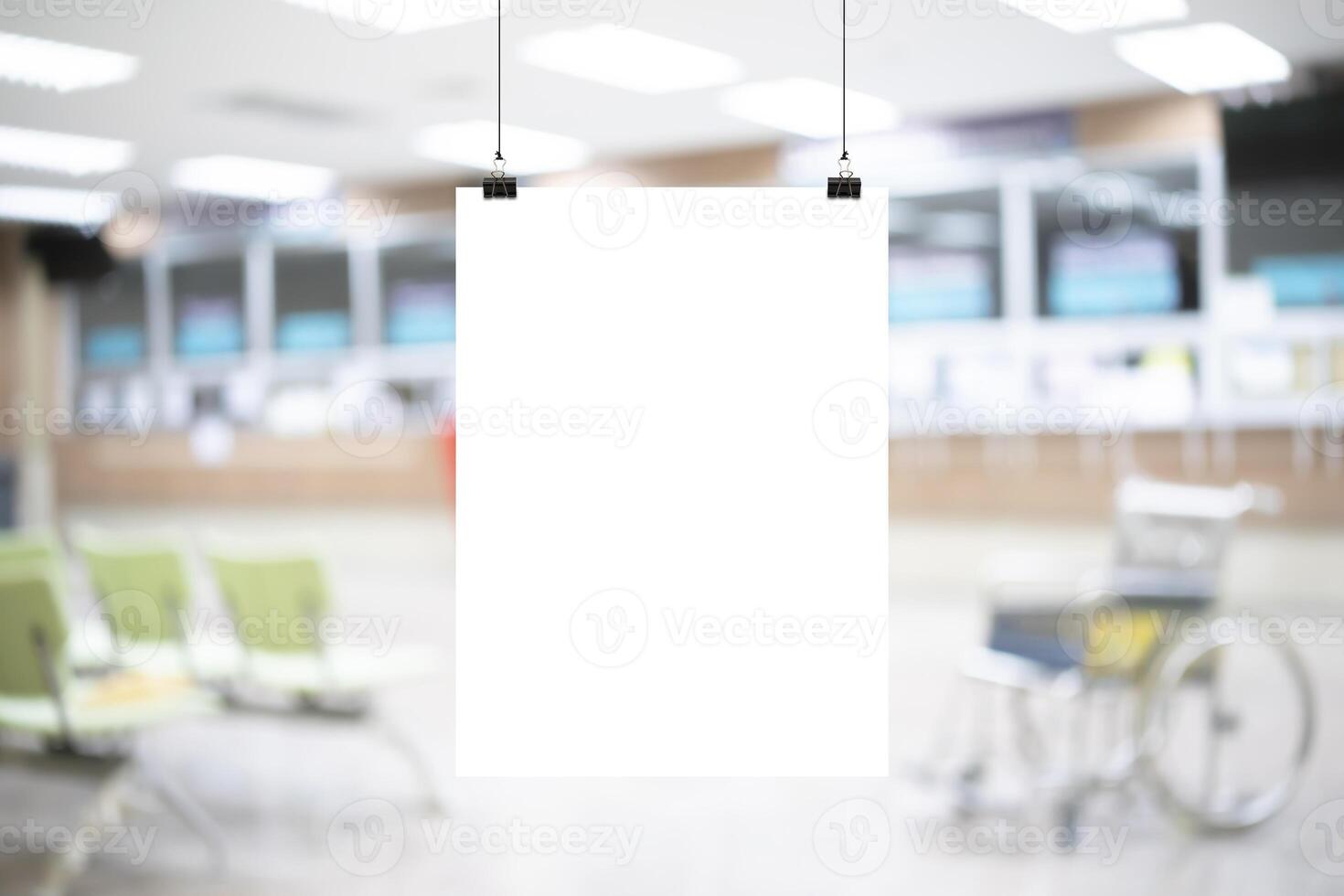 White hospital corridor with doors and white chairs for patients waiting for the doctor visit. A poster. photo