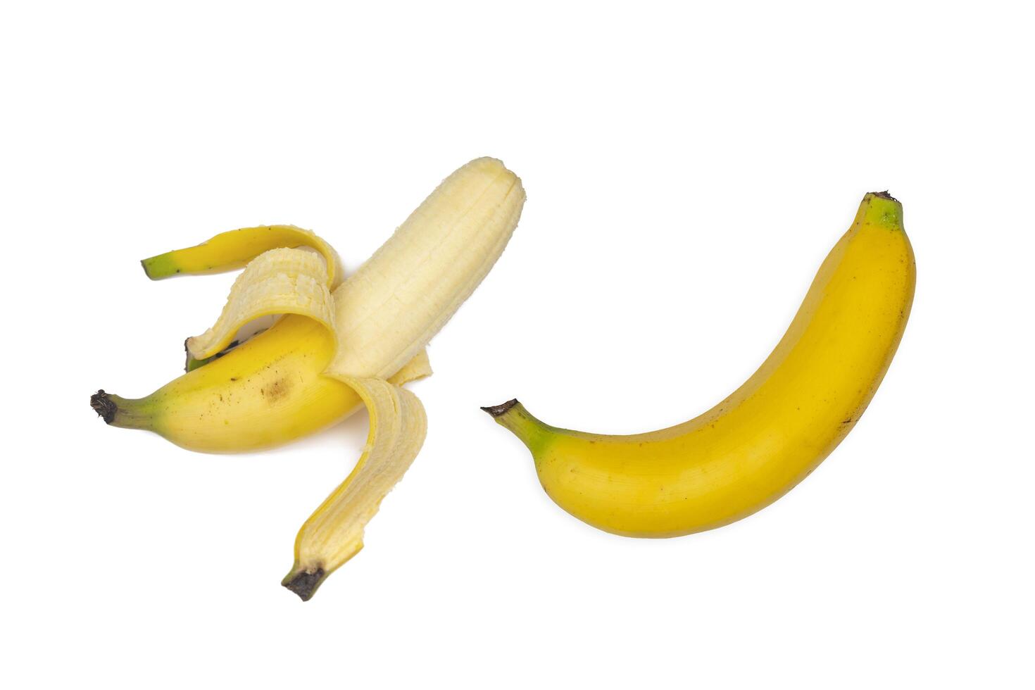 Banana and peeled bananas isolated on white background photo