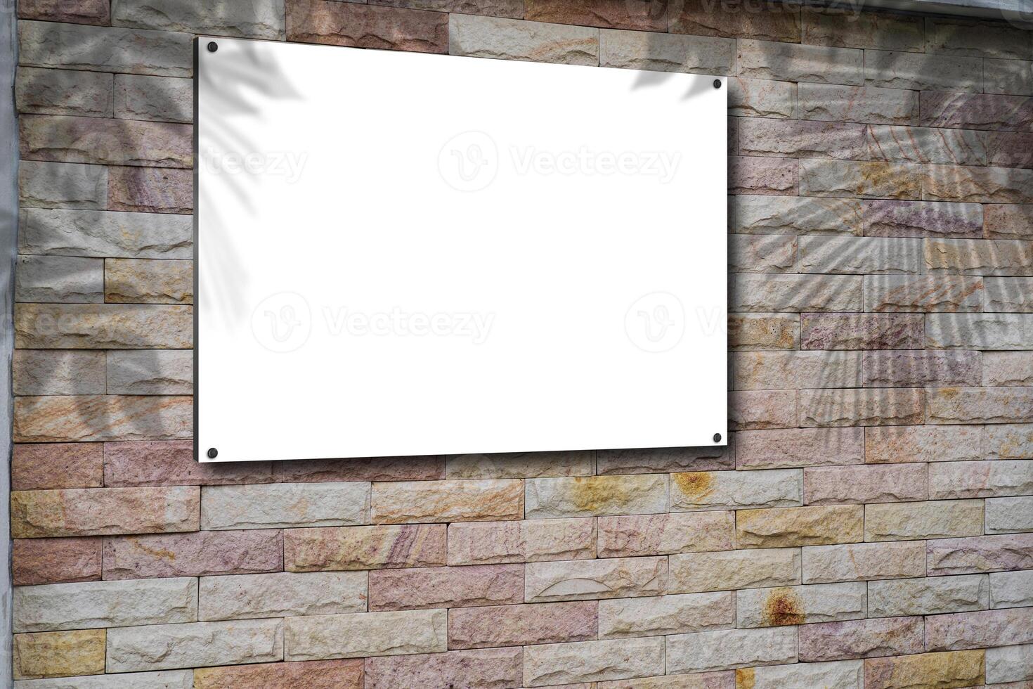 Blank picture frame on brick wall with copy space, framed poster mockup. Distressed red brick wall texture grunge background. photo