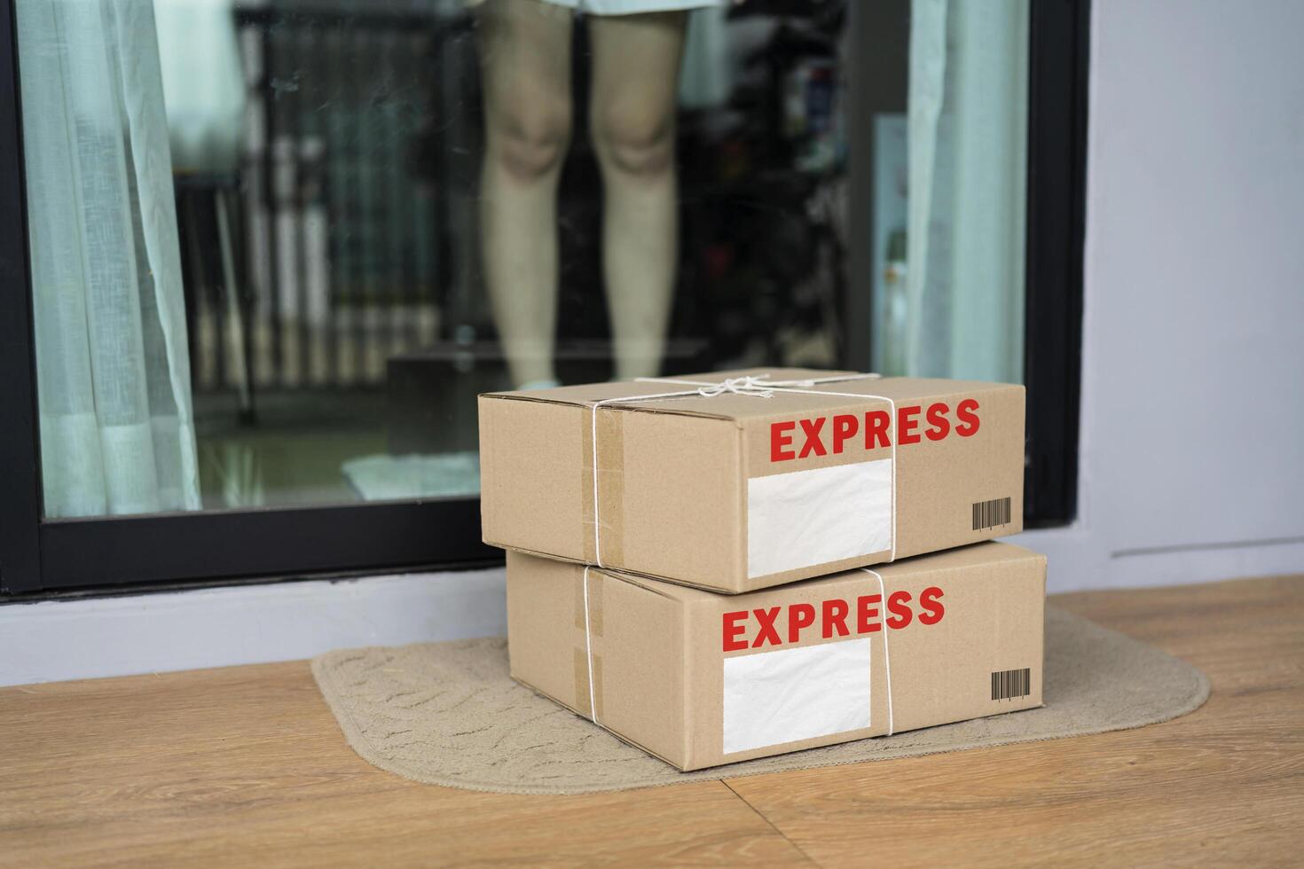 Express parcel delivery outside front door. Add your own copy. Cardboard parcel box near door on floor. Online shopping photo