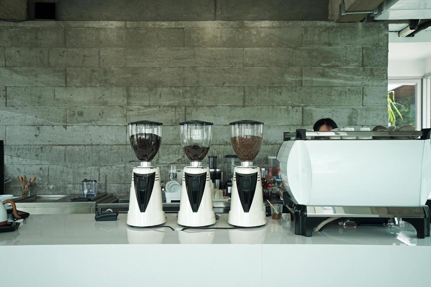 Interior design and decoration of local coffee cafe and bakery shop decorated with white furniture and concrete cement block photo