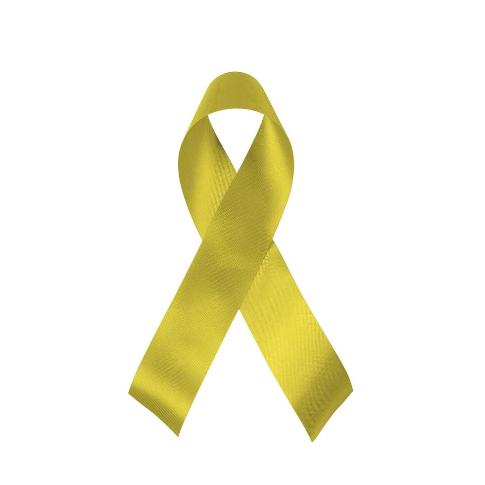 Yellow ribbon isolated on white background. Troop support, suicide prevention, bone cancer, adoptive parents symbol. photo