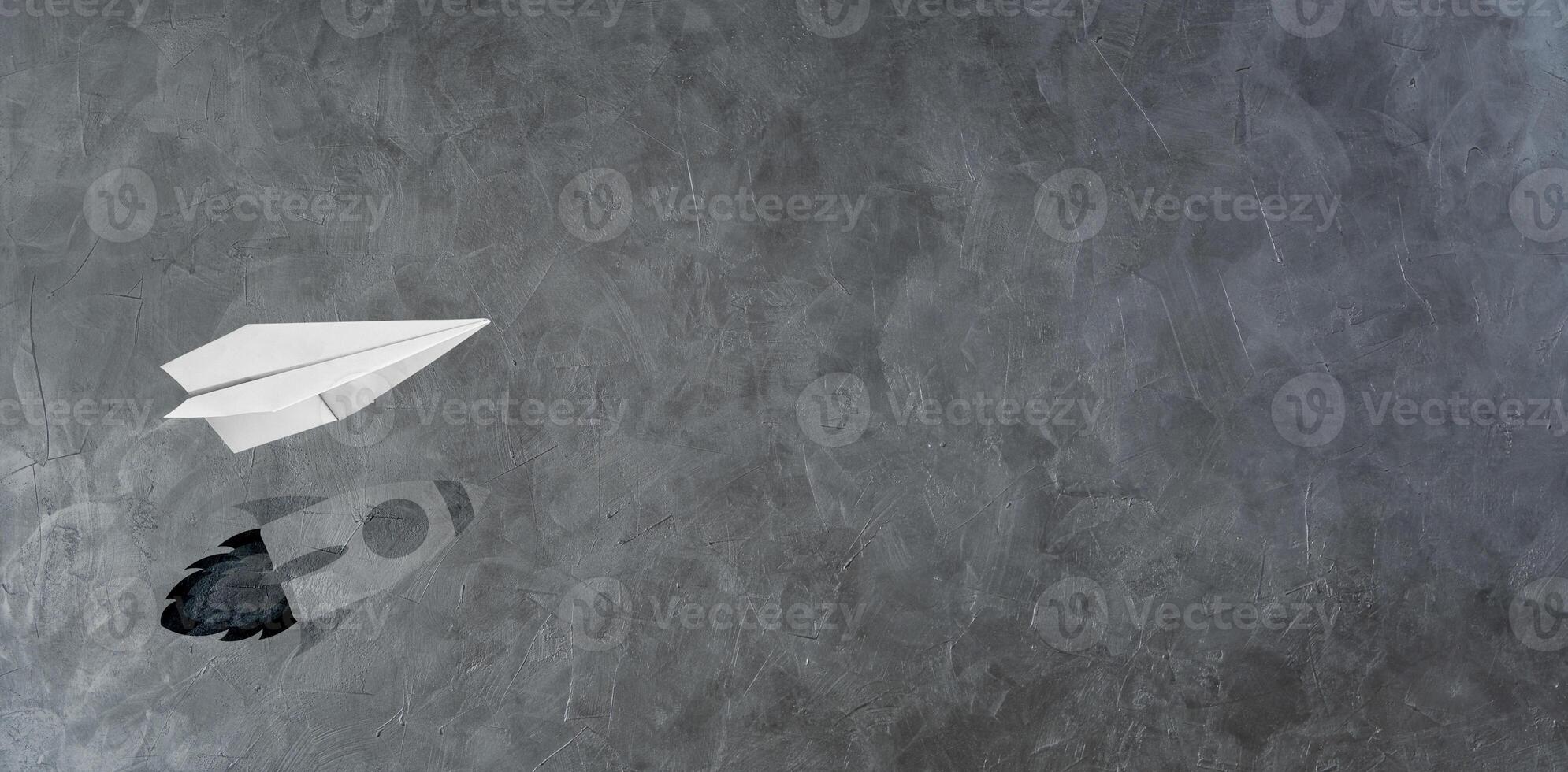 Start-up Company and Motivation in Business Concept. Paper Planes Flying with Shadow of Rocket photo