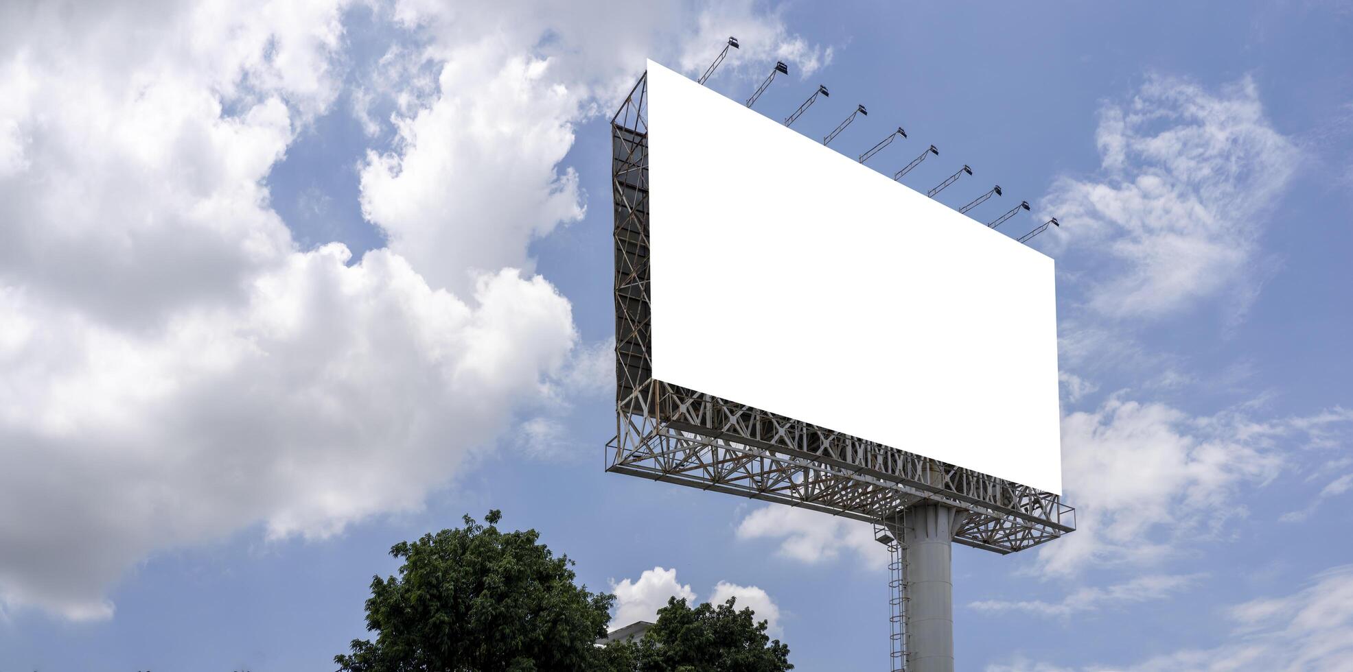 Mockup large billboard or poster displayed on the outdoor against the blue sky background. 3d rendering. photo